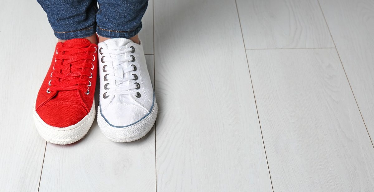 one red shoe and white shoe to show Difference Between a Conversion Ad and a Lead Gen Ad